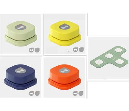 Colorful pet communication buttons in shades of green, yellow, blue, orange, and gray, featuring a bone design on top.