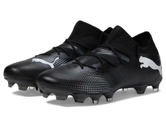 Black and white PUMA Future 7 Match cleats with a sleek design, featuring a prominent logo and textured upper.