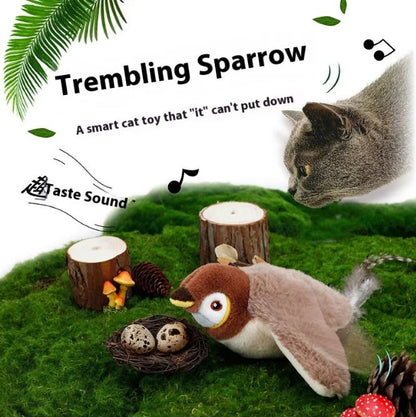 Flapping Bird Cat Toy with plush brown and white body, flapping wings, and realistic bird design, on a green mossy surface.