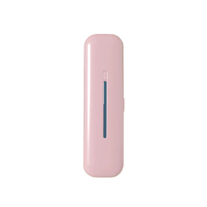 Portable UV Toothbrush Sterilizer in pink, featuring a sleek design with a blue indicator line and compact shape for travel.