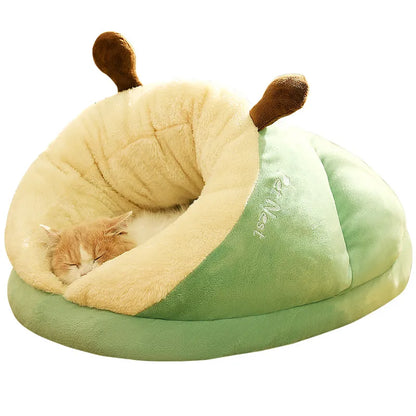 Cozy green and beige pet bed shaped like a slipper, featuring plush fabric and a semi-enclosed design for warmth.