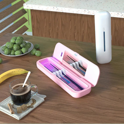 Portable UV Toothbrush Sterilizer shown in pink, open with toothbrushes inside, placed on a wooden table with fruits and coffee nearby.