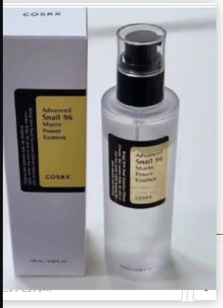 Clear bottle with a pump containing a light liquid, labeled "Advanced Snail 96 Mucin Power Essence" by COSRX, beside a matching box.