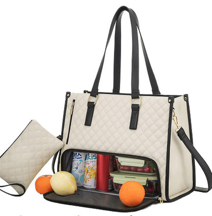 Stylish women's insulated lunch bag in cream with black accents, featuring a spacious compartment and a quilted design.