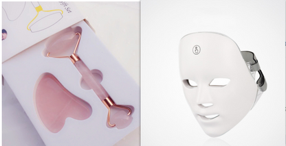 Pink jade roller and Gua Sha set with rose gold accents in an organized box, featuring a sleek white LED facial mask.