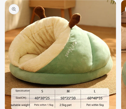 Cozy, green slipper-shaped pet bed with a plush cream interior and cute brown ear details, ideal for small pets.