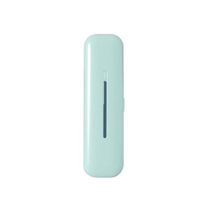 Light green portable UV toothbrush sterilizer with a sleek design and a narrow slot for toothbrush placement.